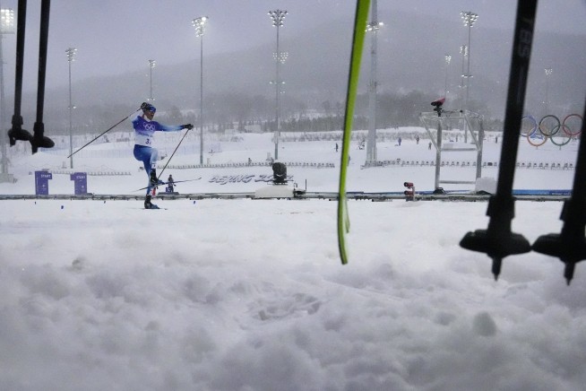 Skiers struggle as real snow falls on Winter Olympics