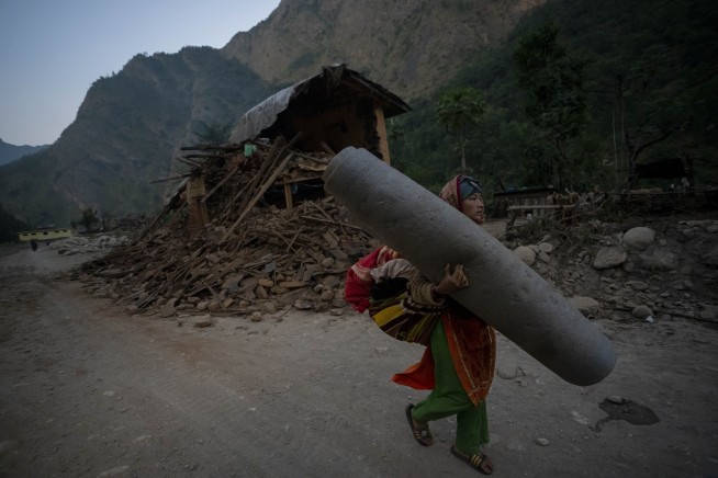 Nepal villagers cremate loved ones who perished in an earthquake that killed 157 people
