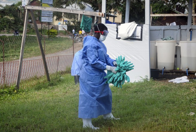 Burial of Ugandan Ebola victim shows flash of confrontation