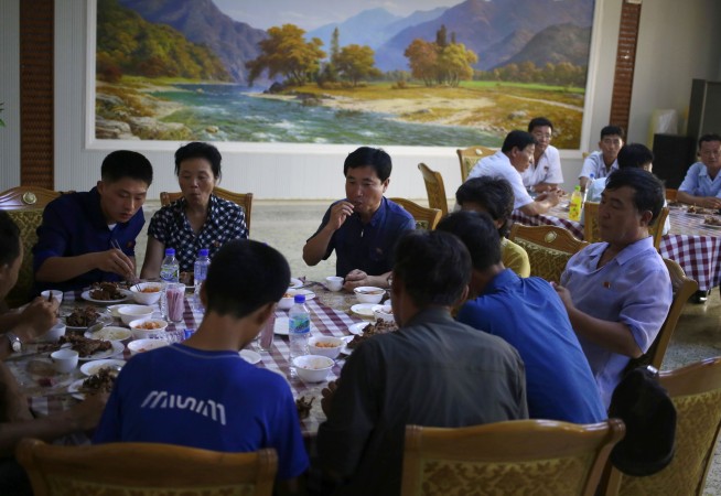 Man bites dog: North Koreans eat dog meat to beat the heat