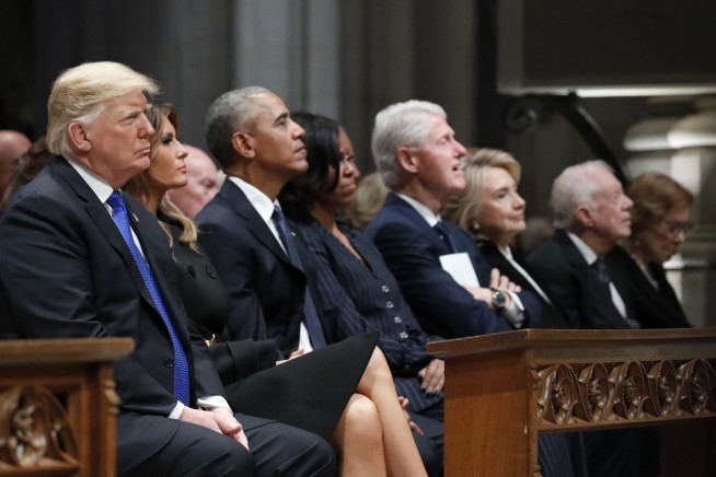 Trump on the fringes of presidents' group at Bush's service
