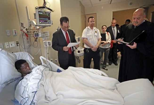 The Latest: Prosecutors say fake gun found at scene