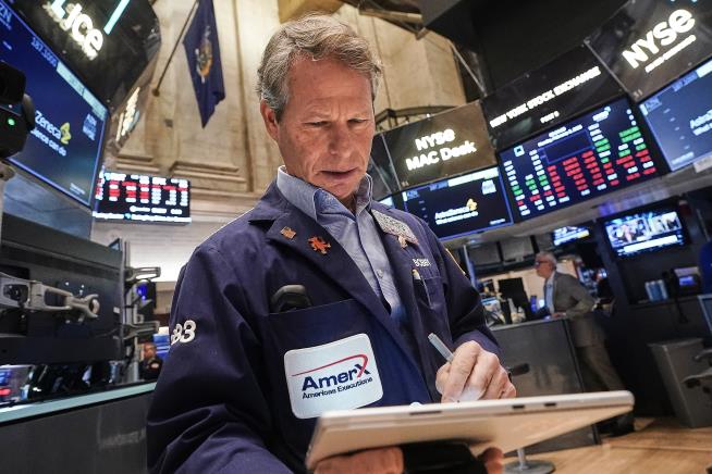 US stocks climb as gold and silver prices keep falling