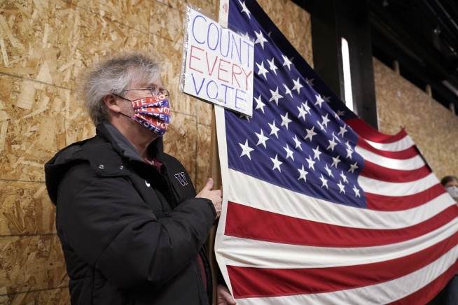 Riot declared in Portland as protesters smash windows