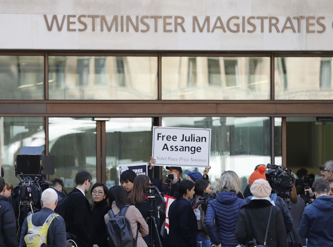 The Latest: WikiLeaks' Assange to fight extradition to US