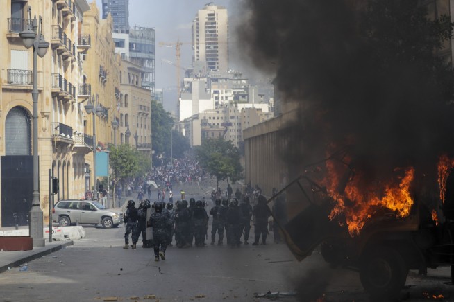 Tear gas, clashes in Beirut amid fury over massive blast
