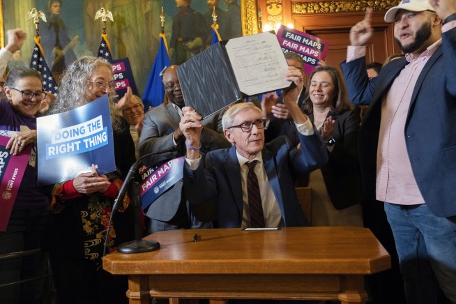 Wisconsin’s Democratic governor signs his new legislative maps into law after Republicans pass them