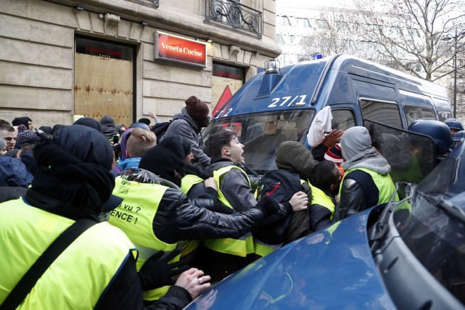 The Latest: France: 135 hurt in protests; 1,000 detained
