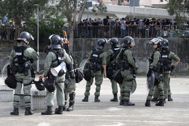 Hong Kong police fire tear gas after protesters defy ban