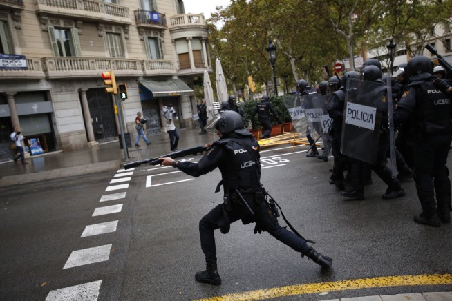 The Latest: Catalans upset, divided after independence vote