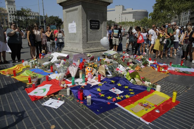 The Latest: Spanish towns race to put up concrete barriers