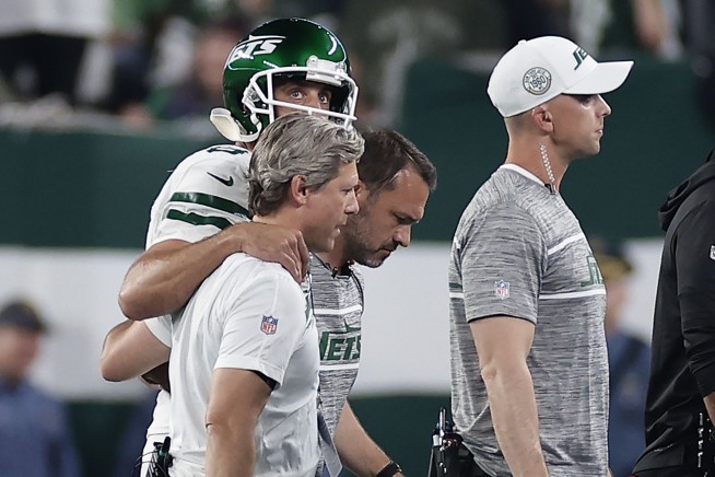 Jets lose Aaron Rodgers to an Achilles tendon injury, then rally to stun Bills 22-16 in overtime