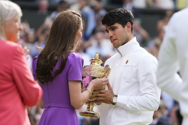 Kate, the Princess of Wales, hands Carlos Alcaraz his Wimbledon trophy in a rare appearance for her