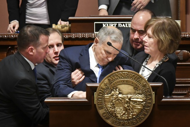 The Latest: Minnesota governor doesn't link cancer, fainting