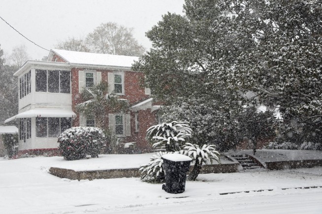 A frigid storm drops rare snow on Houston and New Orleans as Florida readies plows in the Panhandle