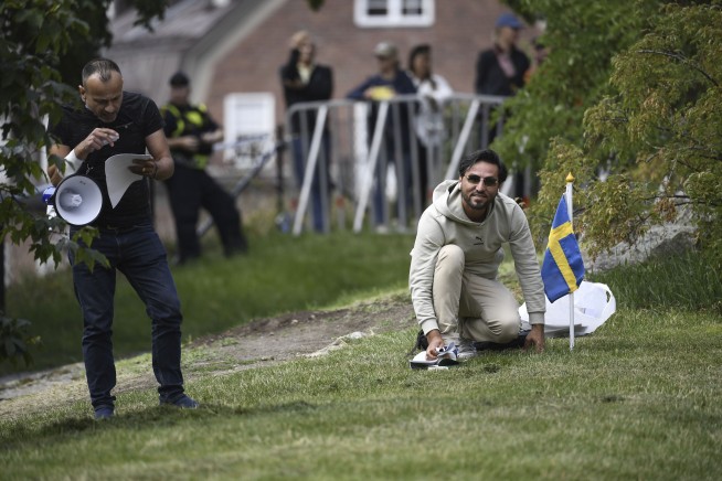 Protesters storm Swedish Embassy in Baghdad after man threatens to burn Quran in Stockholm