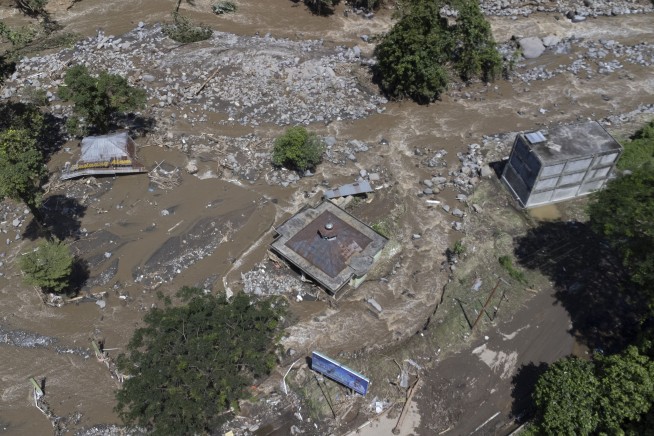 Flash floods and cold lava flow hit Indonesia’s Sumatra island. At least 37 people were killed