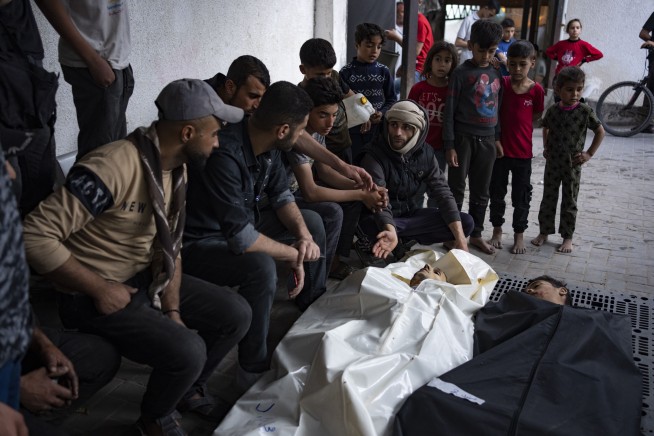 The Latest | Israel ends raid on Gaza hospital; Iran says strike kills 2 generals in Syria