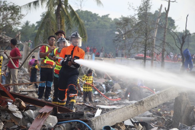 A large explosion at a fireworks warehouse in Thailand kills at least 10 people and wounds dozens