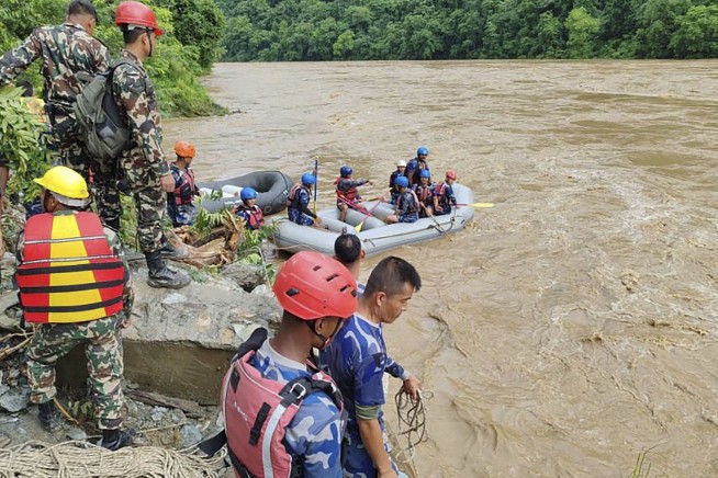2 buses carrying more than 50 people were swept into a river by a landslide in Nepal
