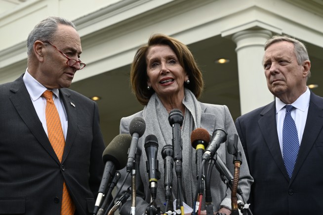 The Latest: Hundreds demonstrate at airport for Trump visit