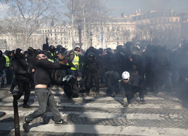 The Latest: French protesters slam Macron's 'empty words'