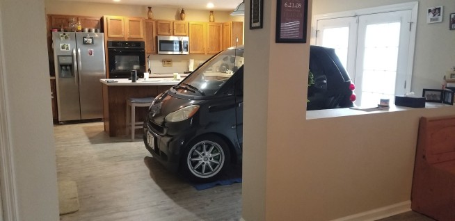 Florida man parks Smart car in kitchen so it won't blow away