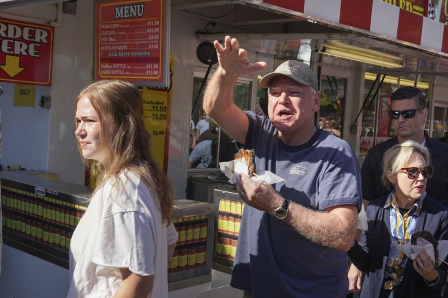 It's a pork chop on a stick and a vanilla shake for Tim Walz at the Minnesota State Fair