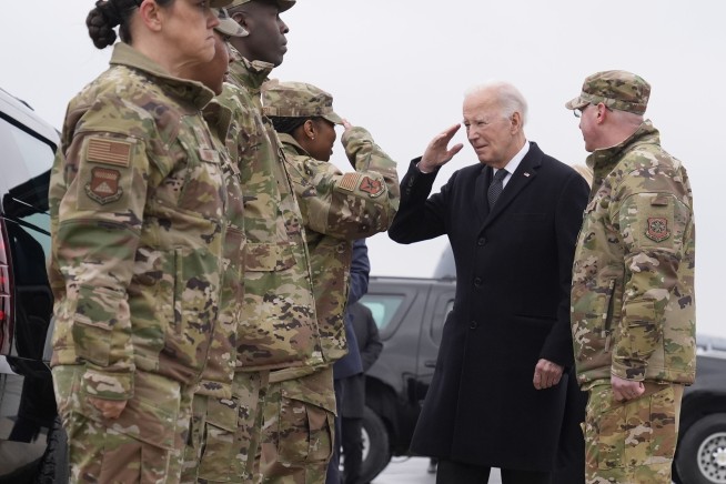 Hand over heart, Biden joins grieving families of US troops killed in Jordan as remains arrive home