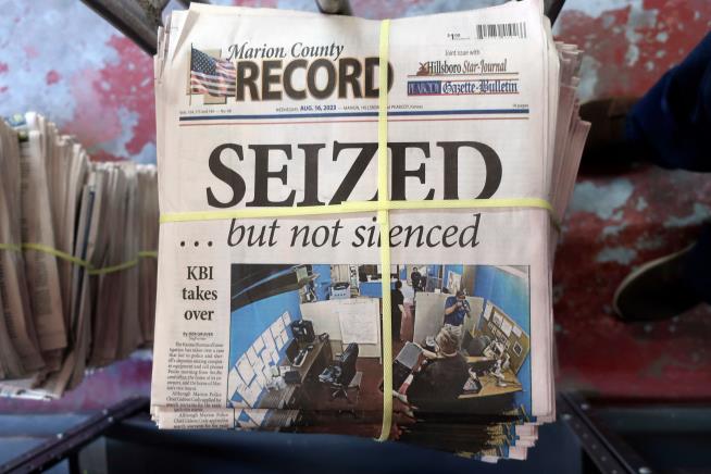 A Kansas county agrees to pay $3 million and apologize over a raid on a small-town newspaper