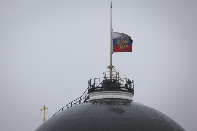 4 men charged in Moscow attack, showing signs of beatings at hearing as court says 2 accept guilt