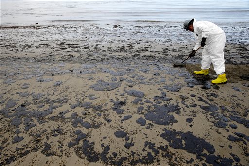Workers clean up oil spill on California beaches by hand