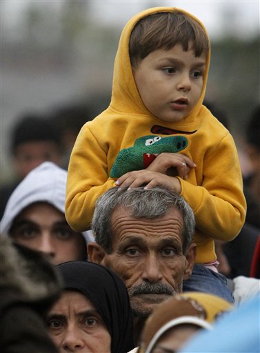 The Latest: EU: Asylum-seekers must apply in 1st EU nation