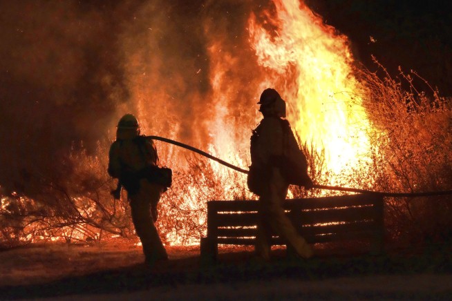 Southern California brushfire forces thousands from homes