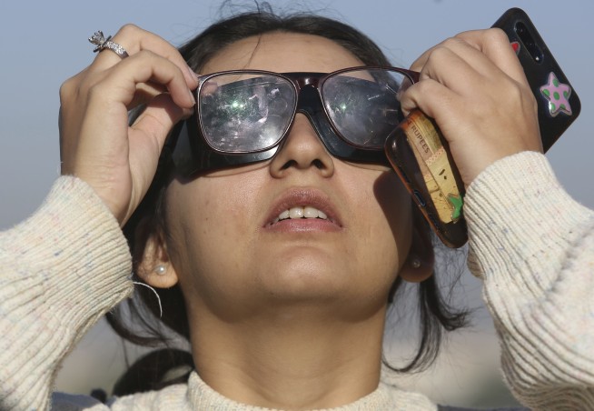 Thousands in Asia marvel at 'ring of fire' solar eclipse