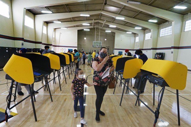 Uber, Lyft spend big, win in California vote about drivers