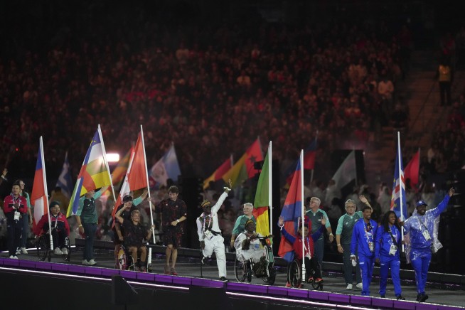 With a parade of athletes on Champs Elysées, France throws one last party for the Paris Olympics