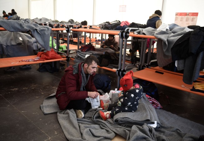 The Latest: German coalition unblocks migrant package