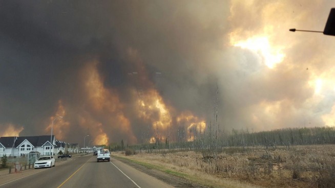 Residents evacuated as fires threaten Canada oil sands town
