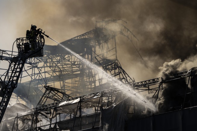 Fire destroys Copenhagen's Old Stock Exchange dating to 1600s, collapsing its dragon-tail spire