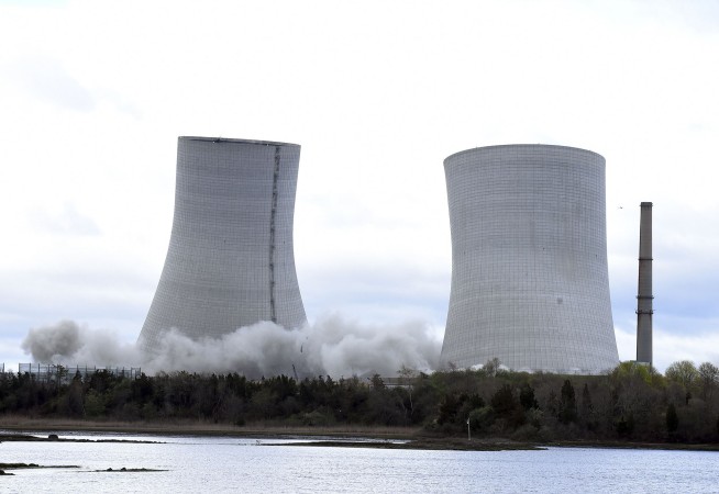 Poof, they're gone: Power plant towers demolished in seconds