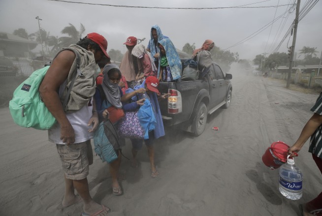 Lava gushes from volcano near Manila; tens of thousands flee