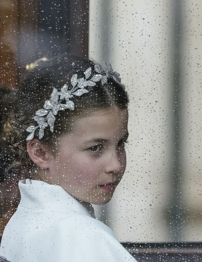 King Charles III crowned with regal pomp, cheers and shrugs