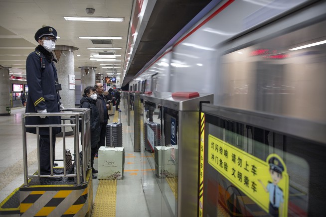 China building a hospital to treat virus, expands lockdowns