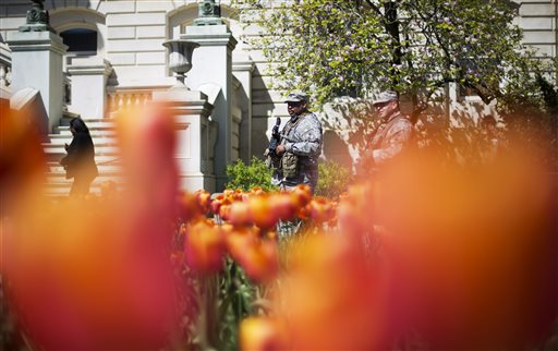 Latest on police-custody death: Protesters march in city
