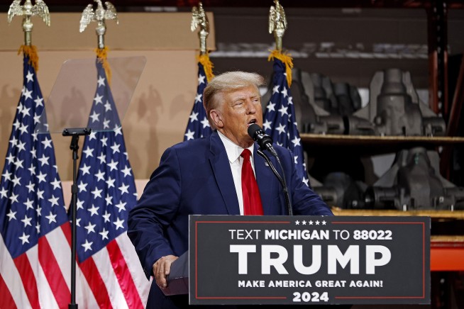 Trump goes to Michigan to rail against Biden's electric vehicle push while GOP rivals debate