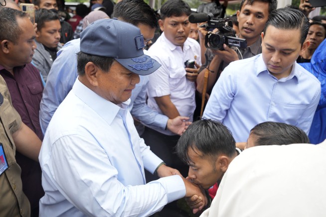 Former Indonesian general linked to human rights abuses claims victory in presidential election