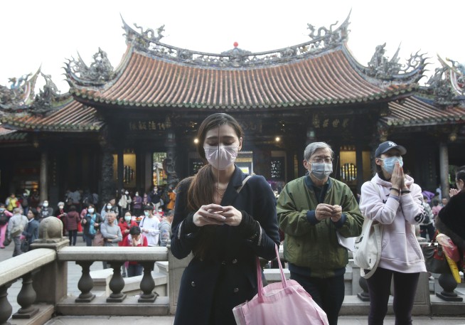 The Latest: Norway, Lithuania close schools, urge spacing