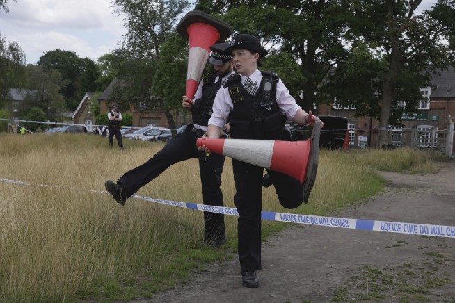 An SUV crash at a London school kills an 8-year-old girl. A woman is arrested for dangerous driving