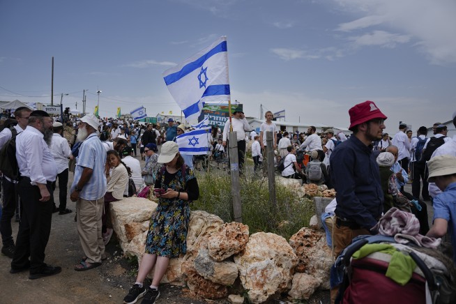In mass rally, Israeli settlers march to West Bank outpost